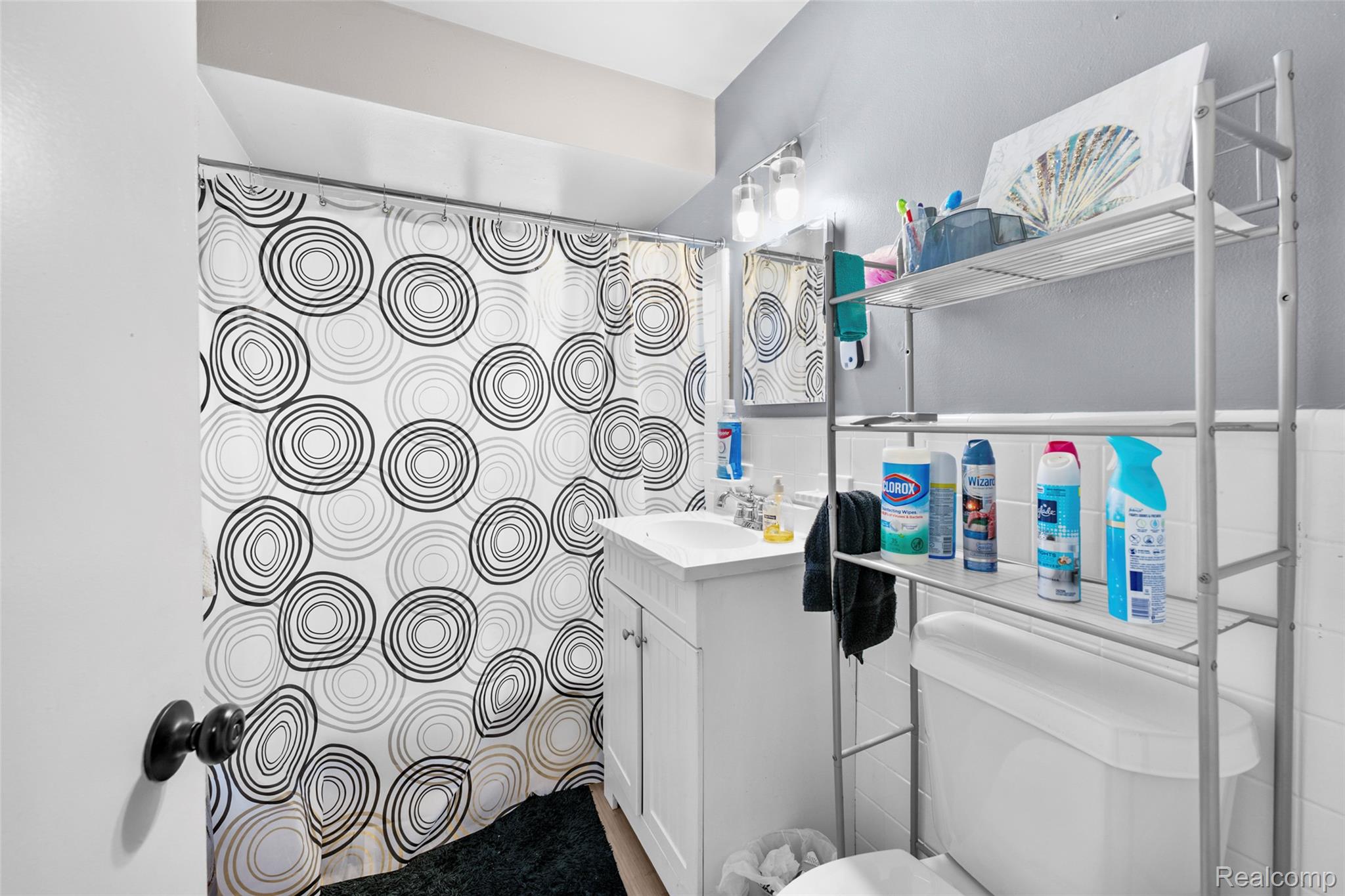 7440-7438 Southfield Road Detroit, MI 48228 - Photo 22 of 24 Bathroom with vanity and tile walls