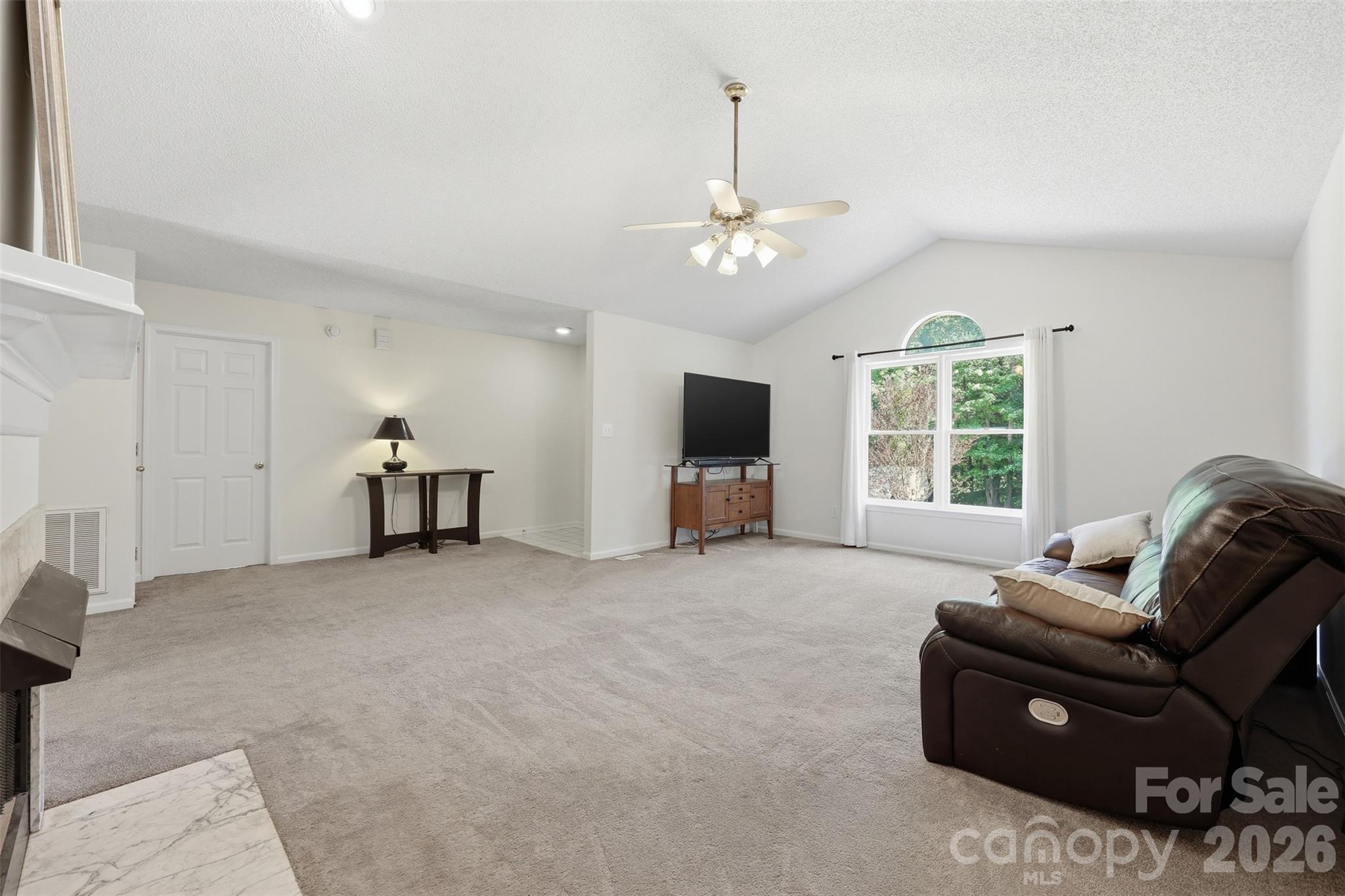 913 Pleasant Ridge Road Fort Mill, SC 29715 - Photo 5 of 40 a living room with furniture and a chandelier