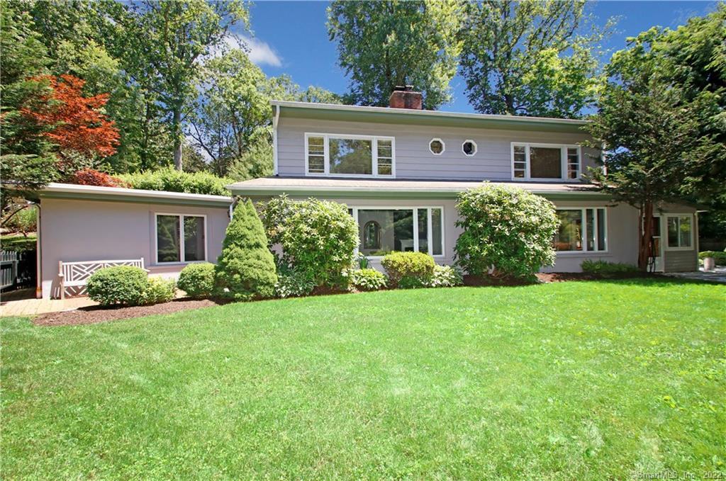 3 Wakefield Road Wilton, CT 06897 - Photo 1 of 1 front view of a house and a yard