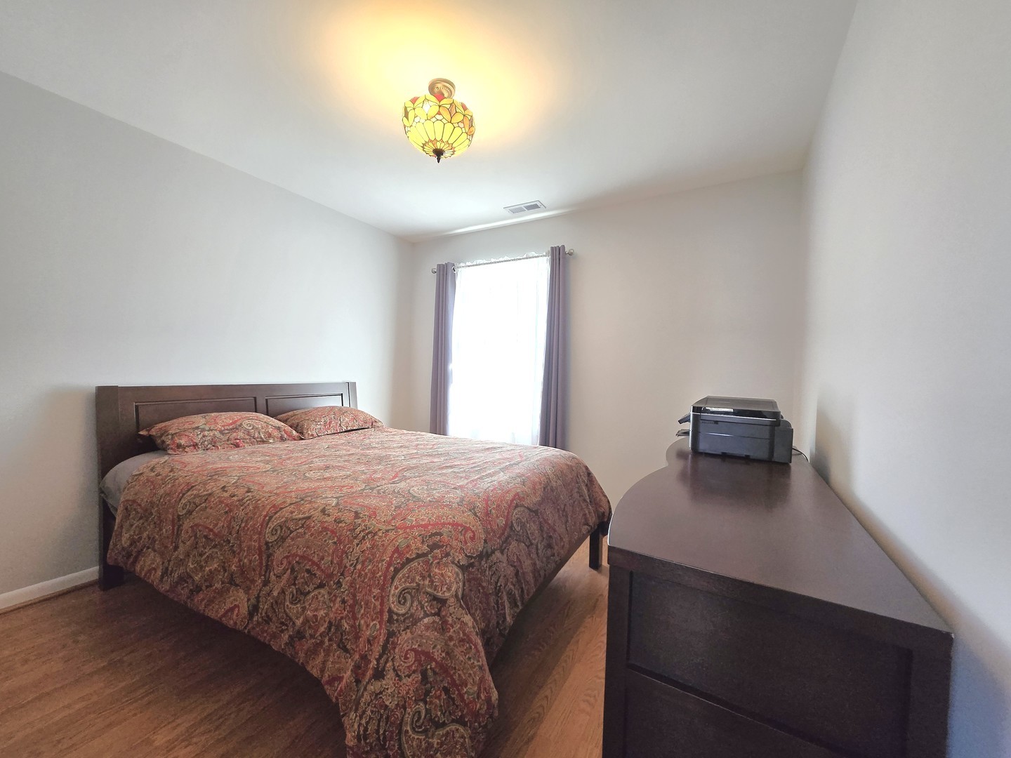 358 Westgate Terrace Streamwood, IL 60107 - Photo 28 of 39 a bedroom with a bed and a table