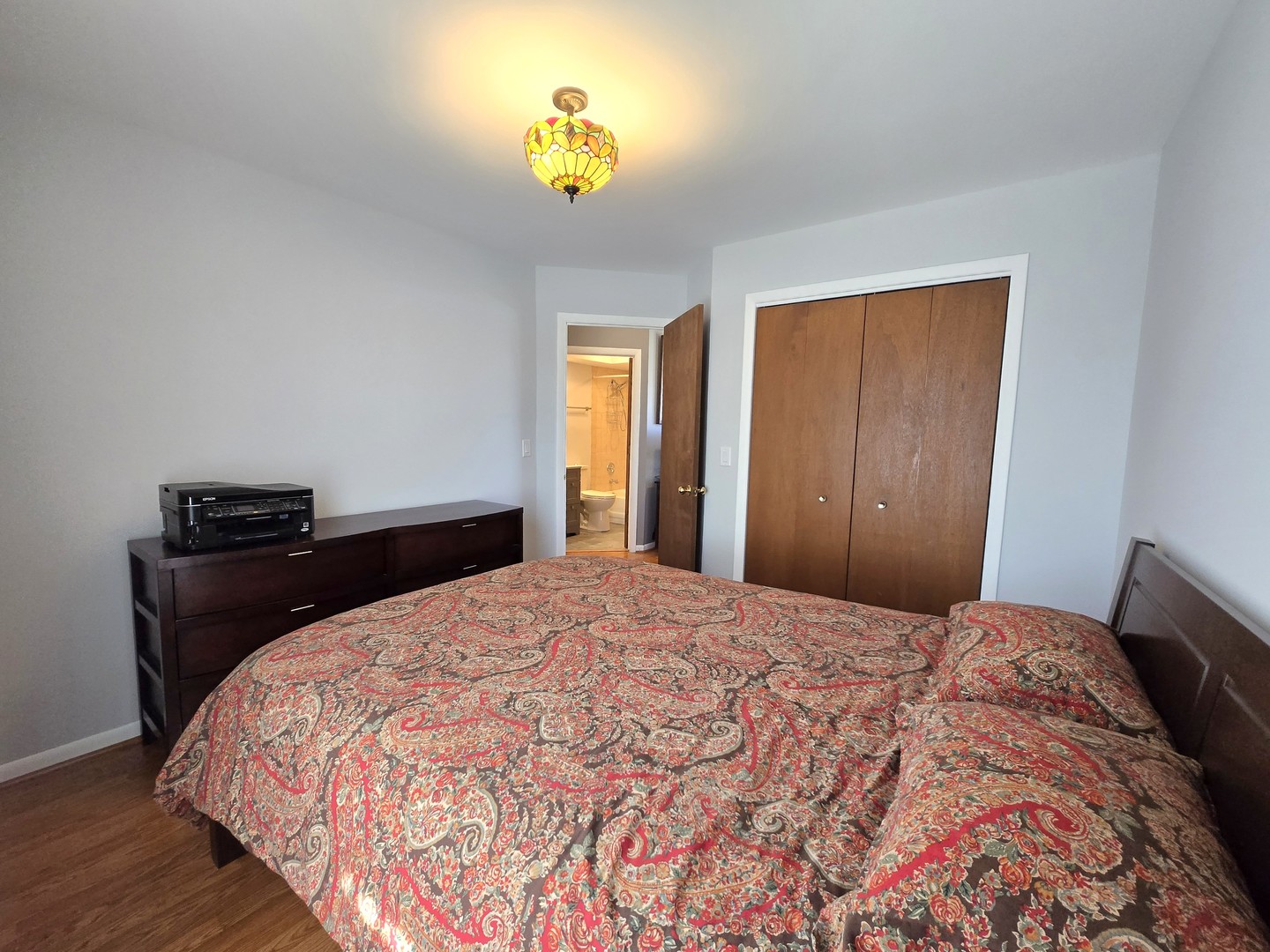 358 Westgate Terrace Streamwood, IL 60107 - Photo 29 of 39 a bedroom with a bed and lamps