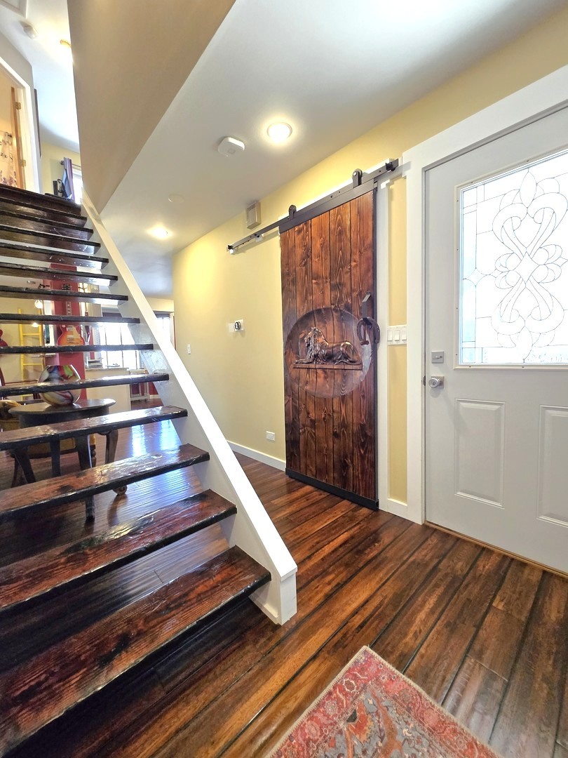 358 Westgate Terrace Streamwood, IL 60107 - Photo 5 of 39 a view of entryway with wooden floor