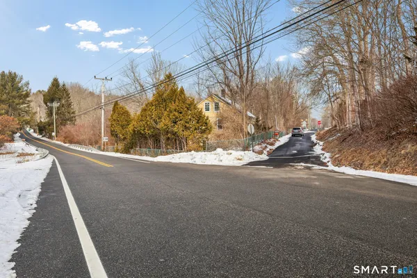 a view of a street with a snow on the road