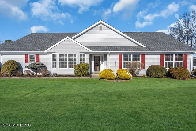 a view of a house with a backyard