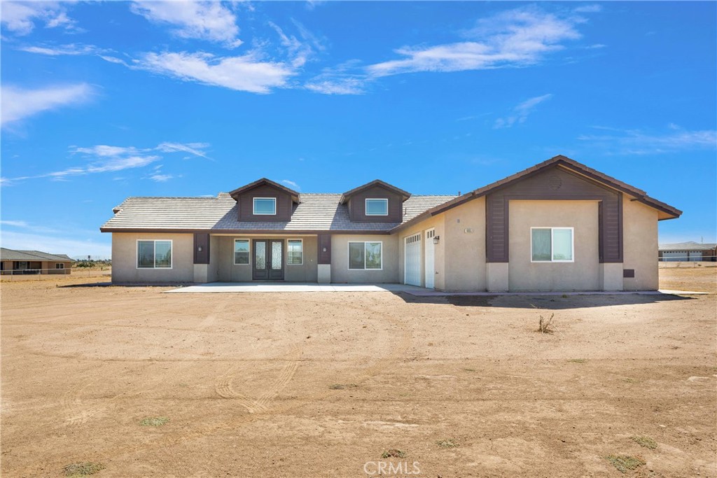 10055 Eaby Road Phelan, CA 92371 - Photo 1 of 19 a front view of house with yard and trees in the background