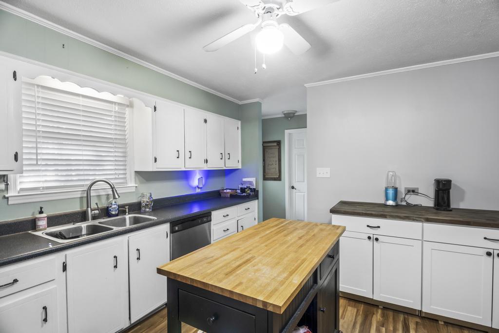 1934 Huntsman Drive Aiken, SC 29803 - Photo 6 of 19 a kitchen with a stove sink and cabinets