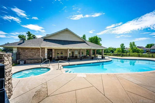 a view of swimming pool with seating space