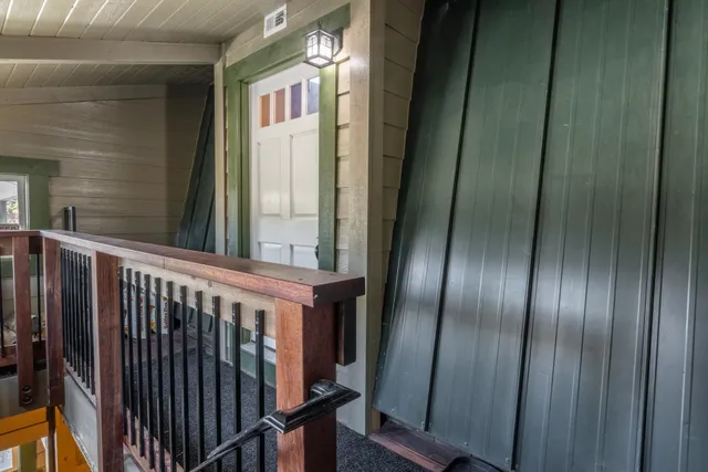 a view of staircase with wooden floor