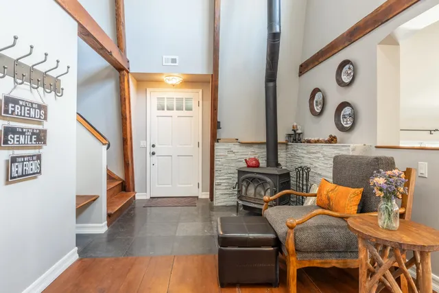 a dining room with furniture and wooden floor