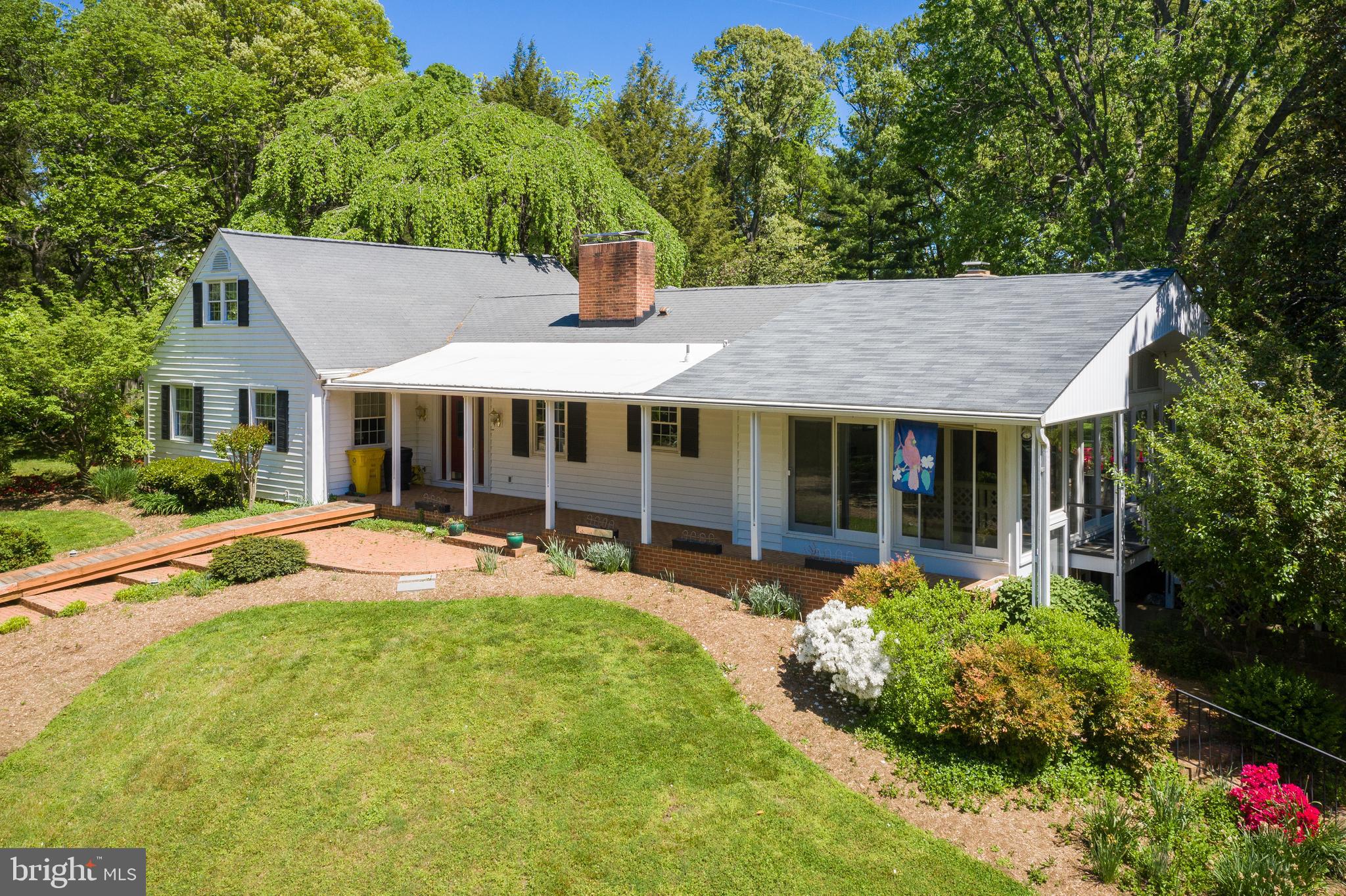 1533 Widows Mite Road Edgewater, MD 21037 - Photo 1 of 29 a front view of a house with swimming pool having outdoor seating