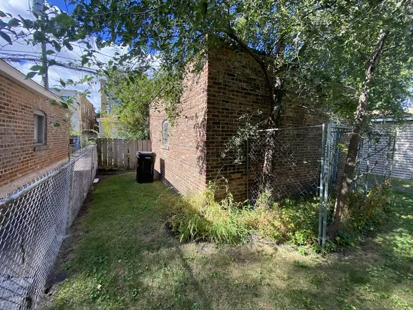 a view of backyard and entertaining space