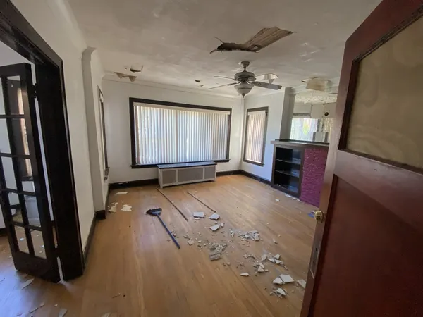 a view of entryway with stairs and wooden floor