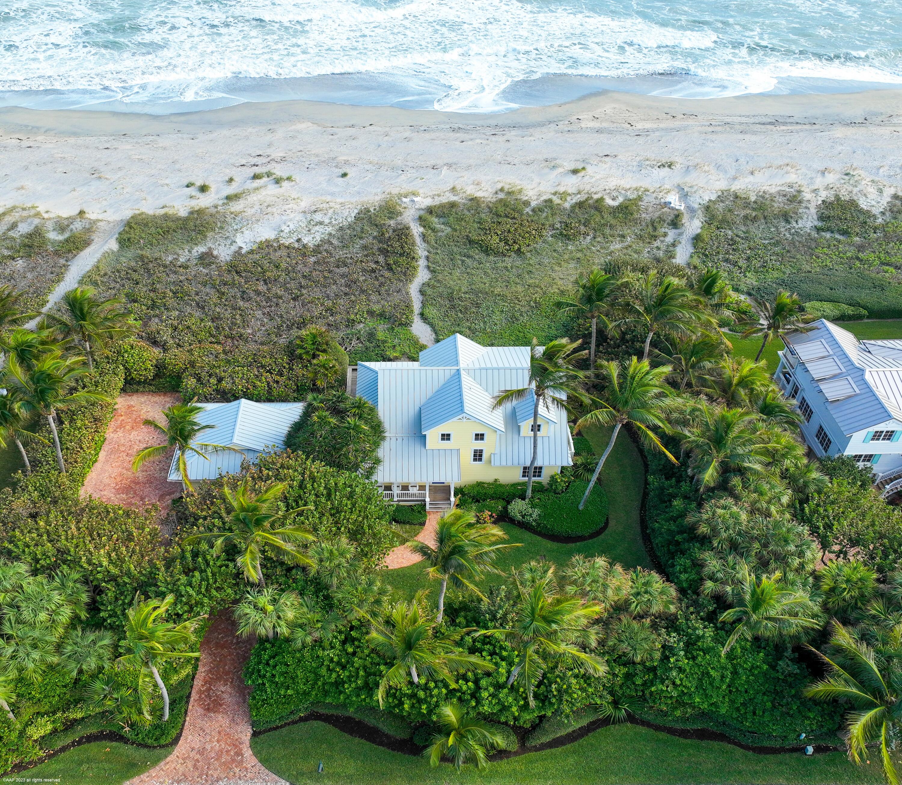 107 North Beach Road Jupiter Island, FL 33455 - Photo 11 of 55 an aerial view of a house with lots of trees