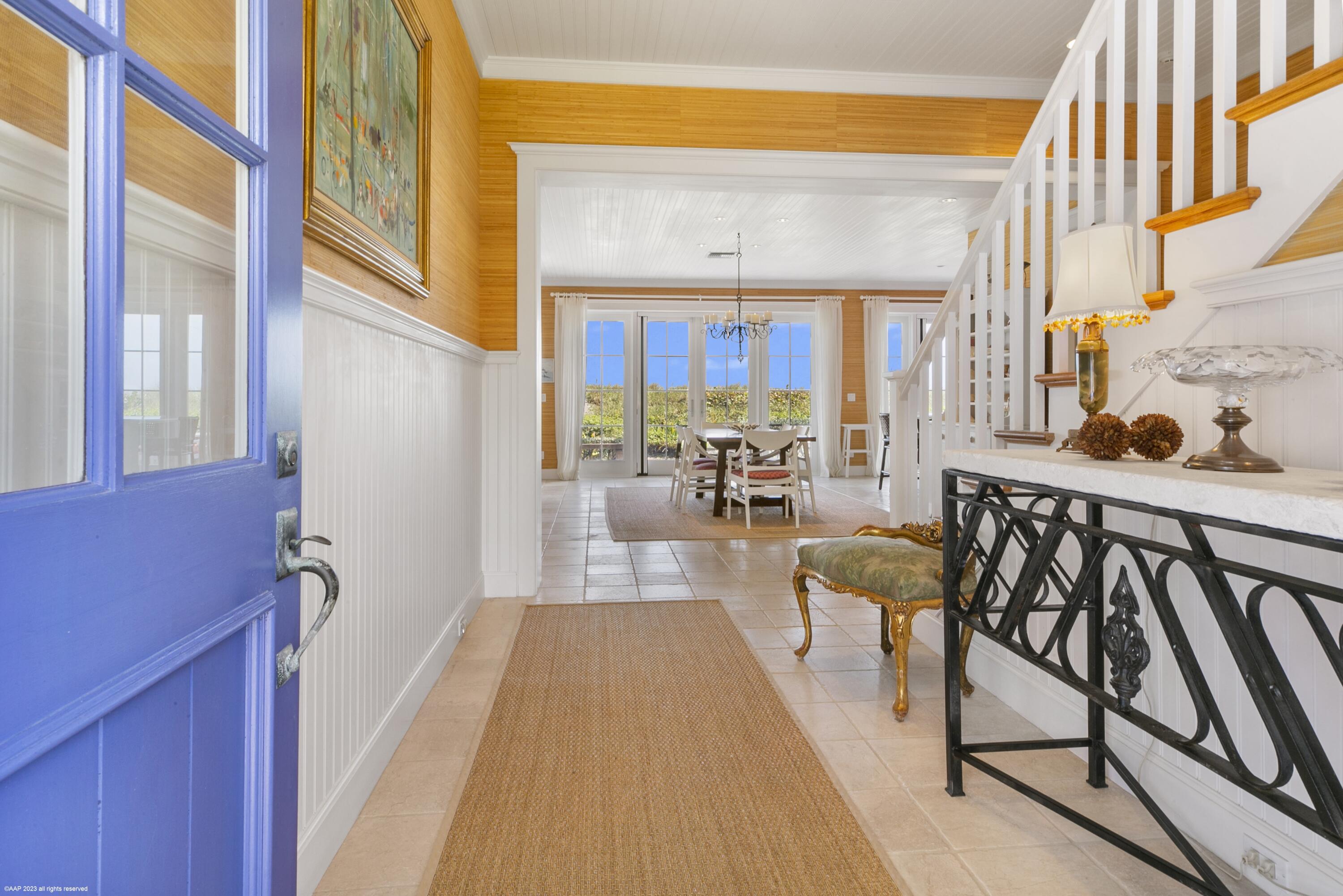 107 North Beach Road Jupiter Island, FL 33455 - Photo 16 of 55 a view of a balcony and chairs