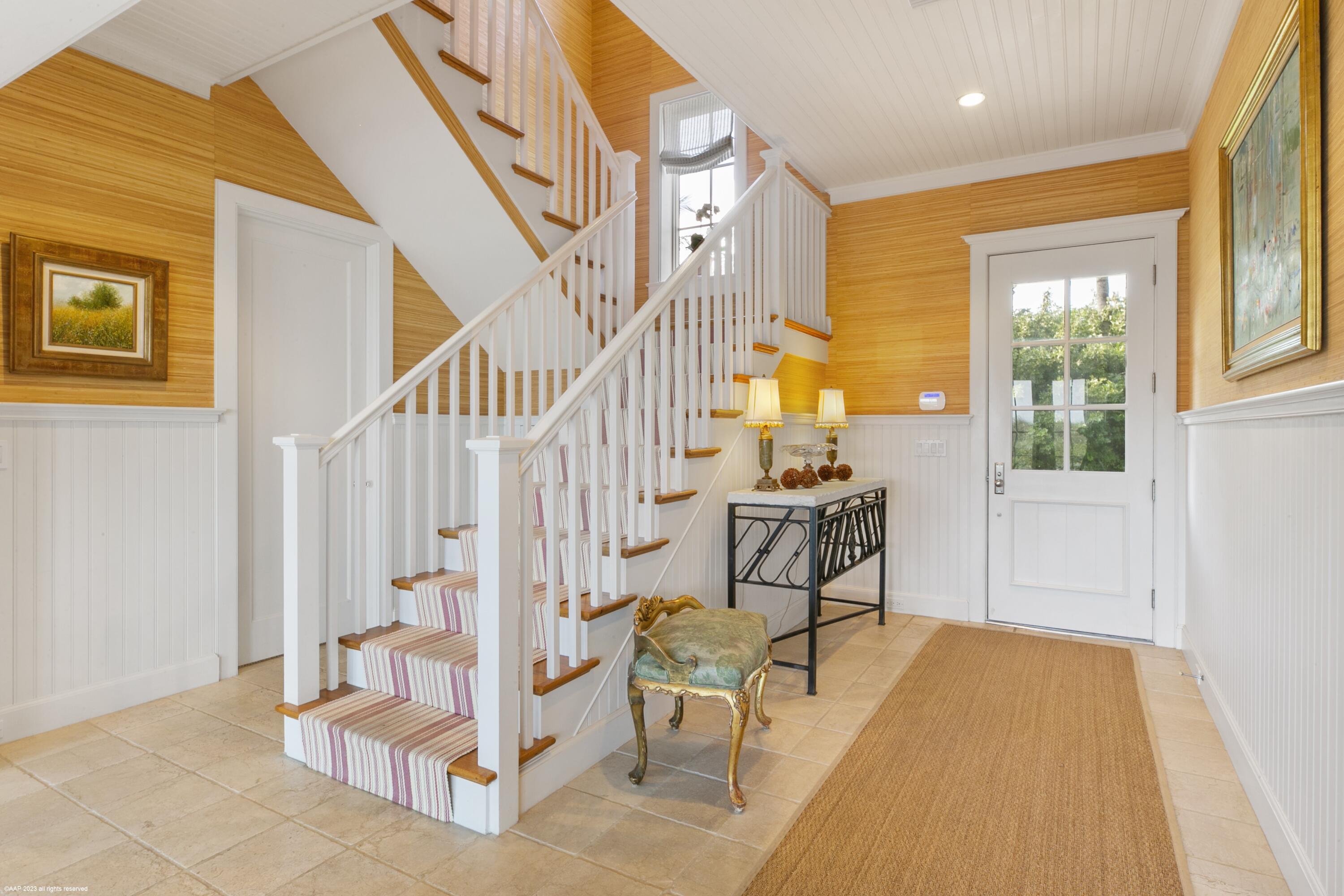 107 North Beach Road Jupiter Island, FL 33455 - Photo 17 of 55 a view of an entryway with staircase