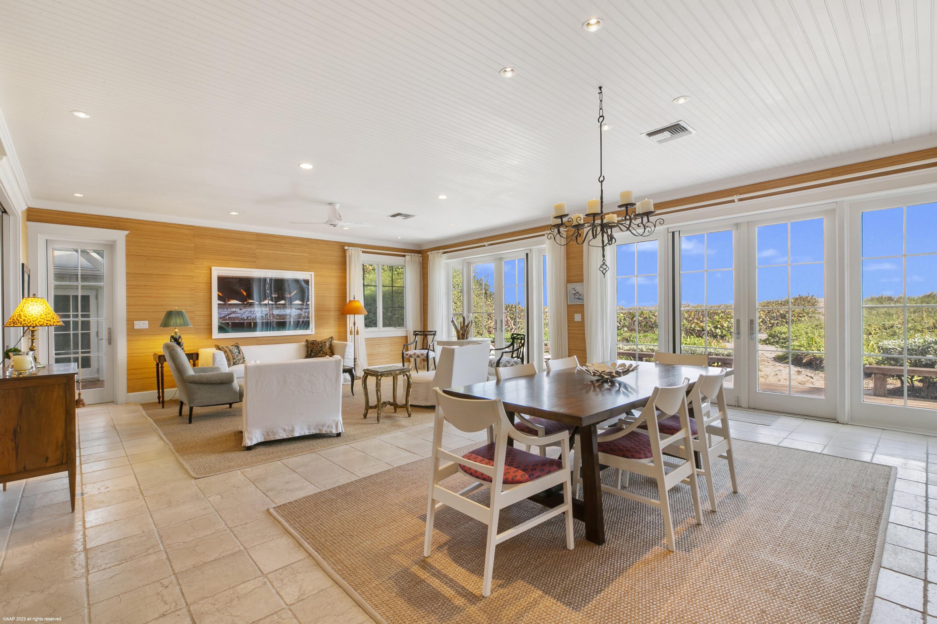 107 North Beach Road Jupiter Island, FL 33455 - Photo 18 of 55 a view of a dining room with furniture window and wooden floor