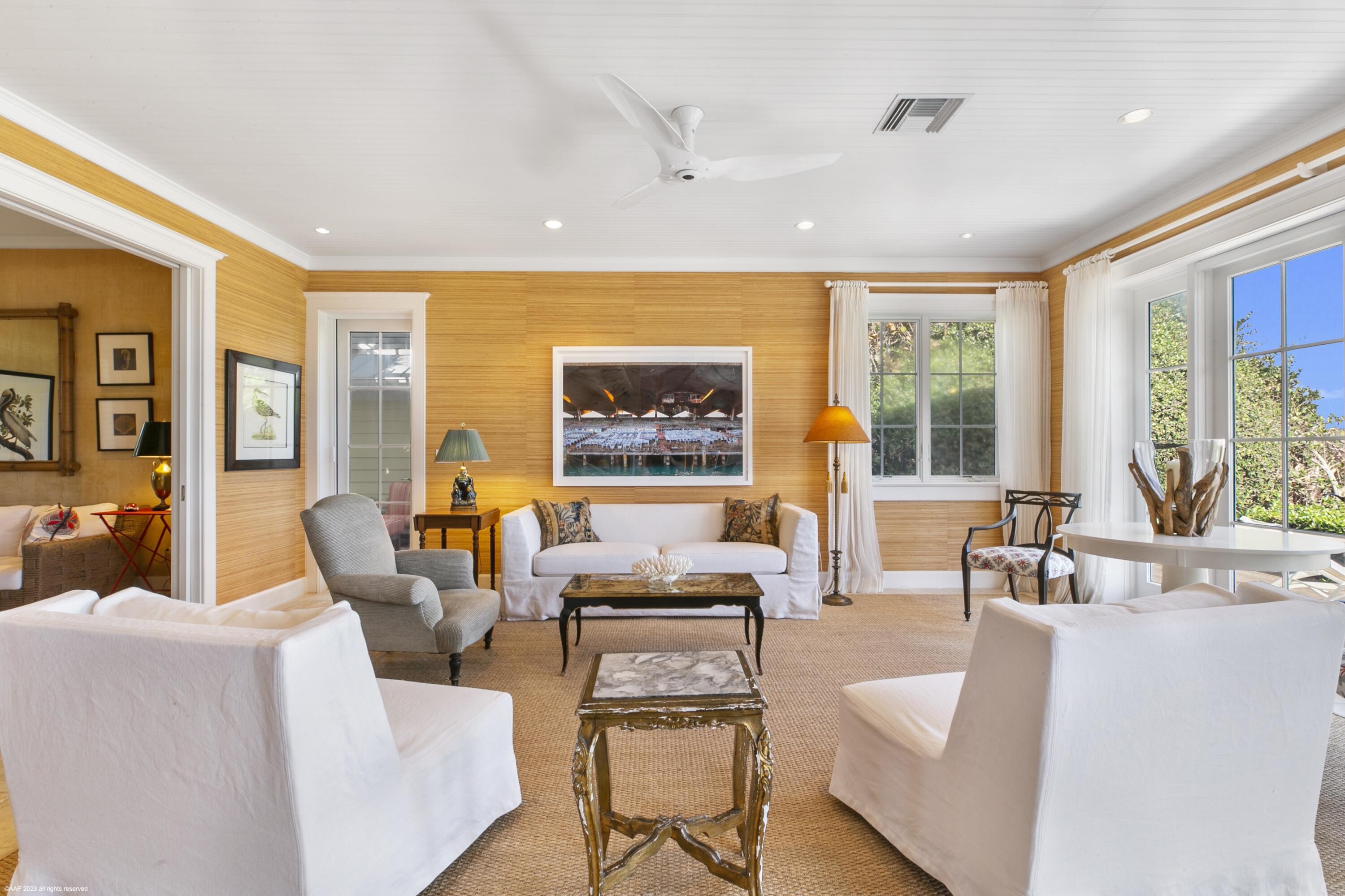 107 North Beach Road Jupiter Island, FL 33455 - Photo 20 of 55 a living room with furniture and large windows