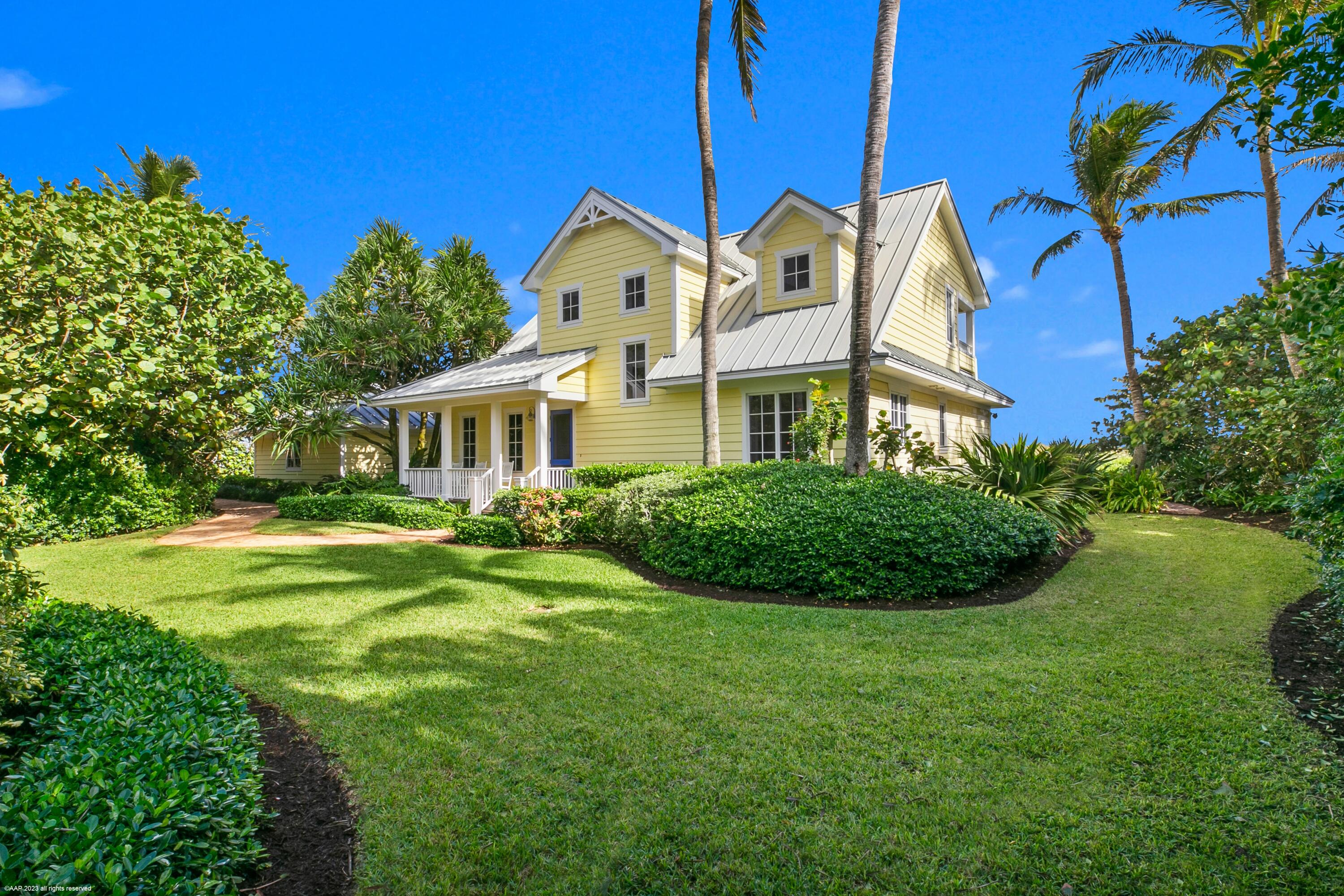 107 North Beach Road Jupiter Island, FL 33455 - Photo 2 of 55 a view of a house with a big yard and potted plants