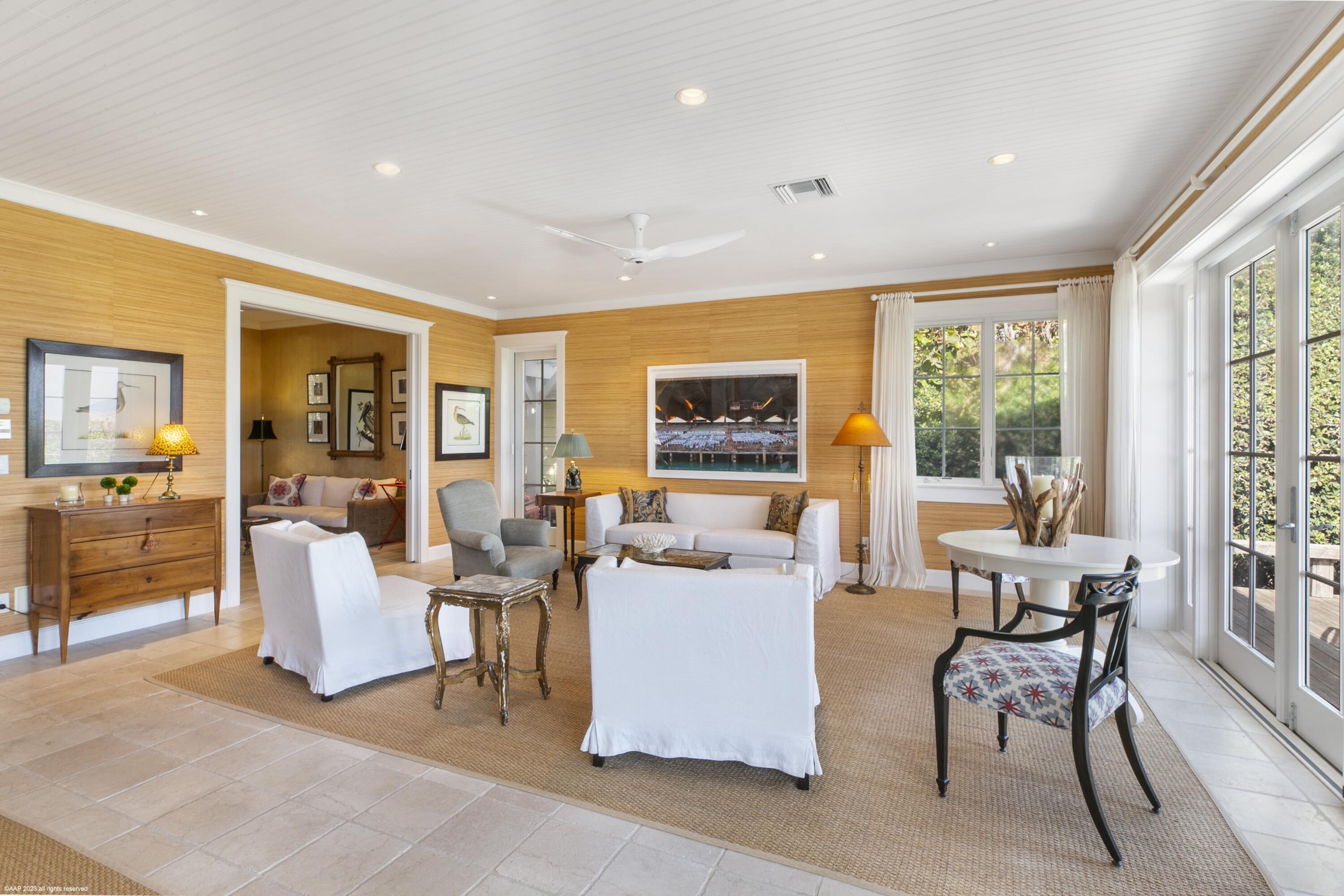 107 North Beach Road Jupiter Island, FL 33455 - Photo 21 of 55 a living room with fireplace furniture and a large window