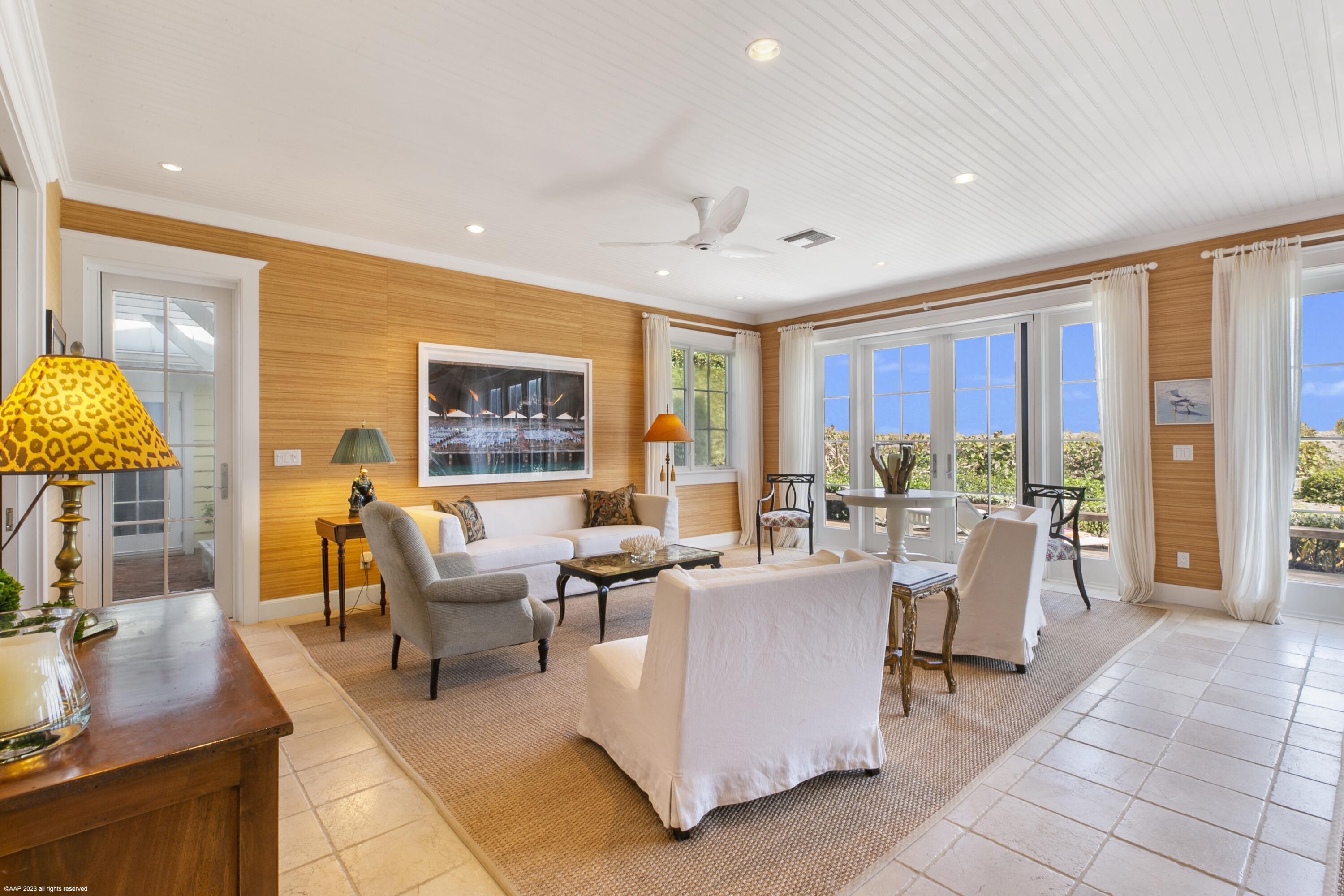 107 North Beach Road Jupiter Island, FL 33455 - Photo 22 of 55 a living room with fireplace furniture and a large window