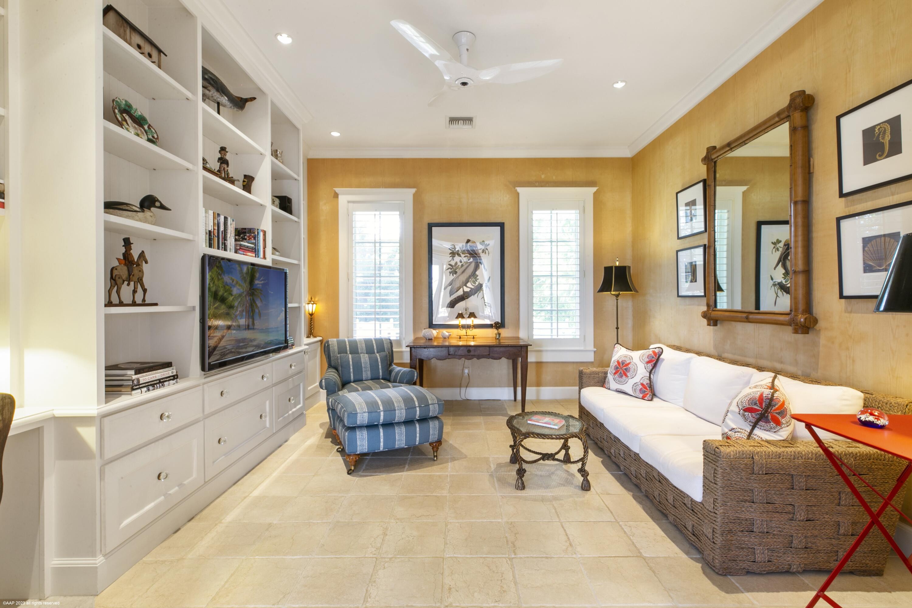 107 North Beach Road Jupiter Island, FL 33455 - Photo 27 of 55 a living room with furniture and a flat screen tv