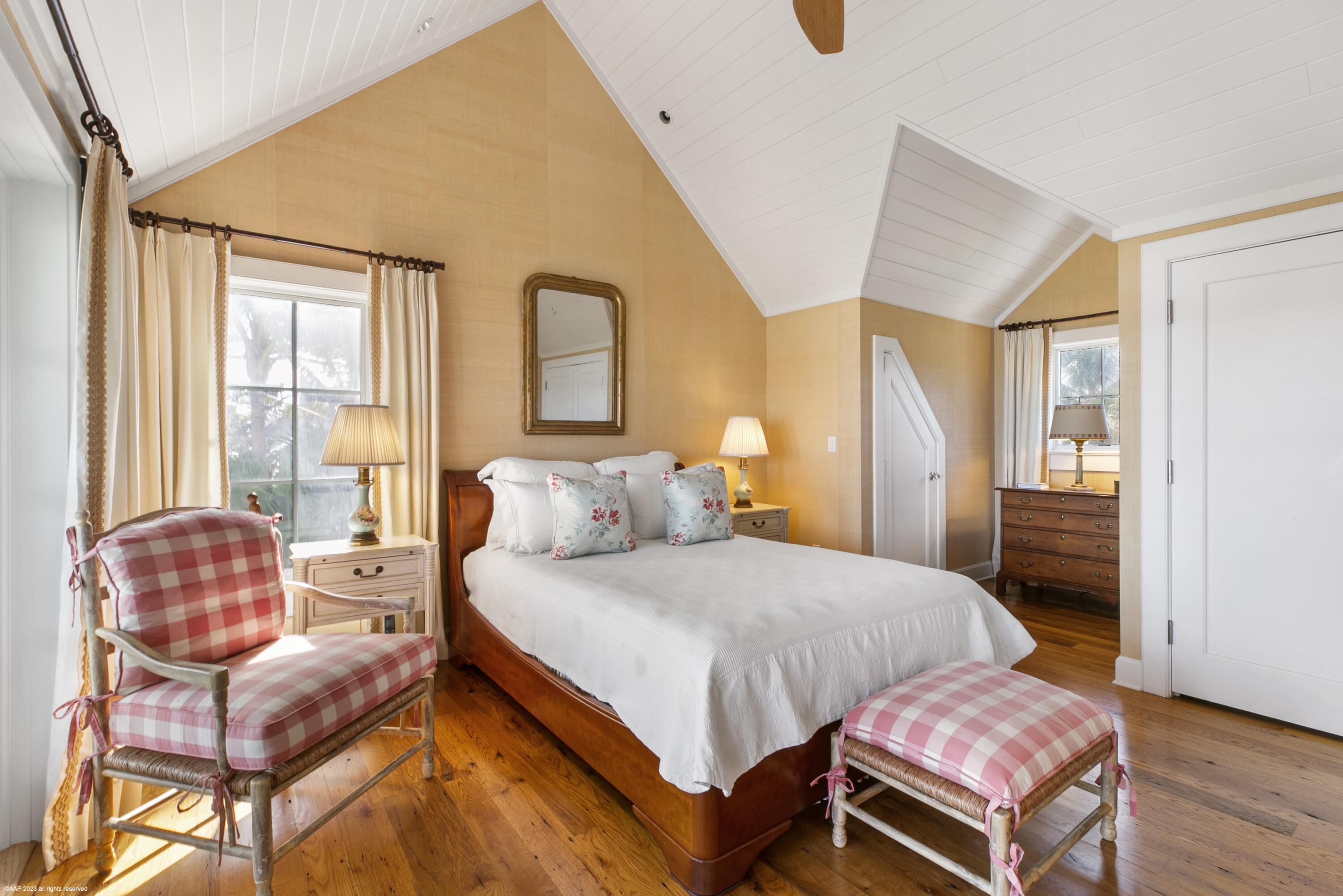 107 North Beach Road Jupiter Island, FL 33455 - Photo 28 of 55 a bedroom with a bed and wooden floor