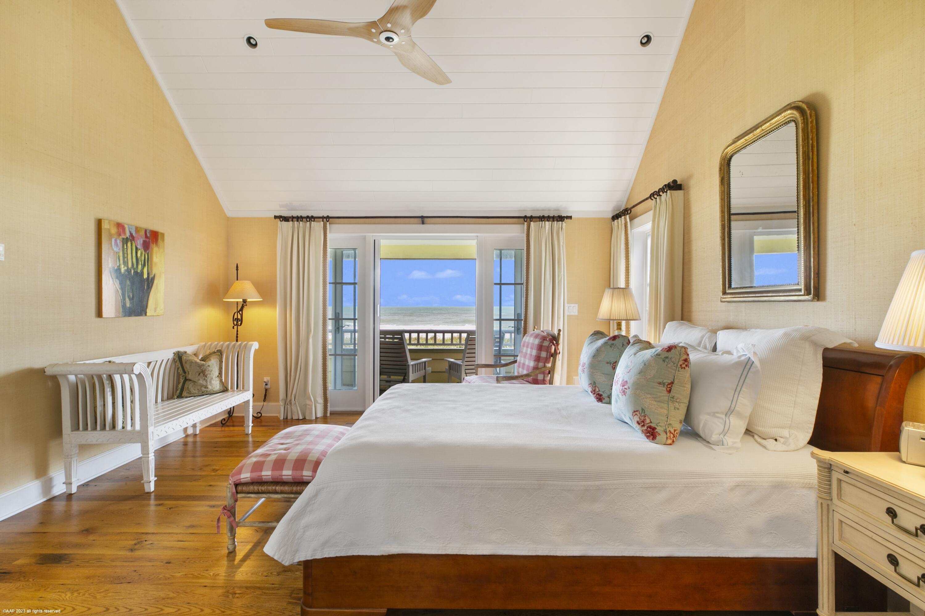 107 North Beach Road Jupiter Island, FL 33455 - Photo 29 of 55 a bedroom with a bed and wooden floor