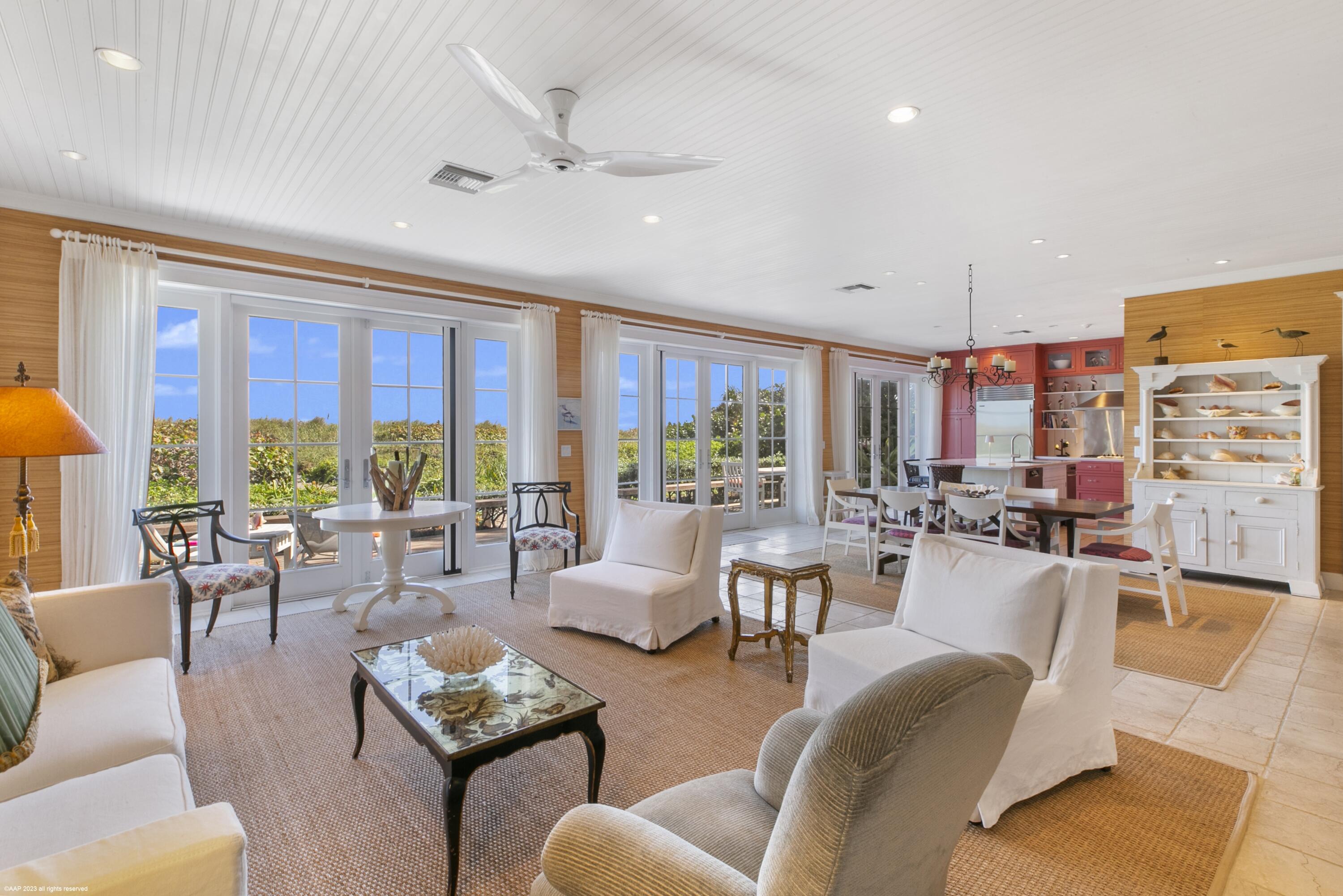 107 North Beach Road Jupiter Island, FL 33455 - Photo 3 of 55 a living room with furniture and a large window