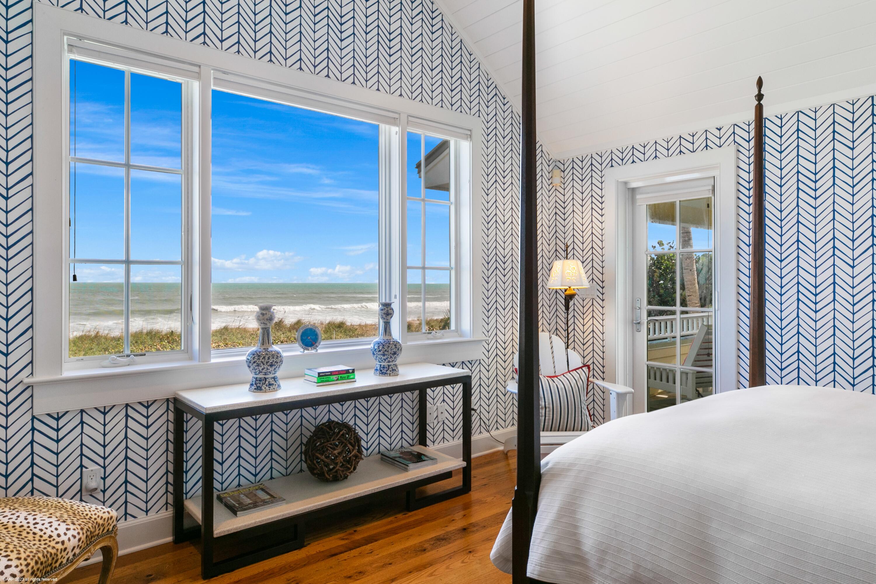107 North Beach Road Jupiter Island, FL 33455 - Photo 33 of 55 a bedroom with a bed and a window