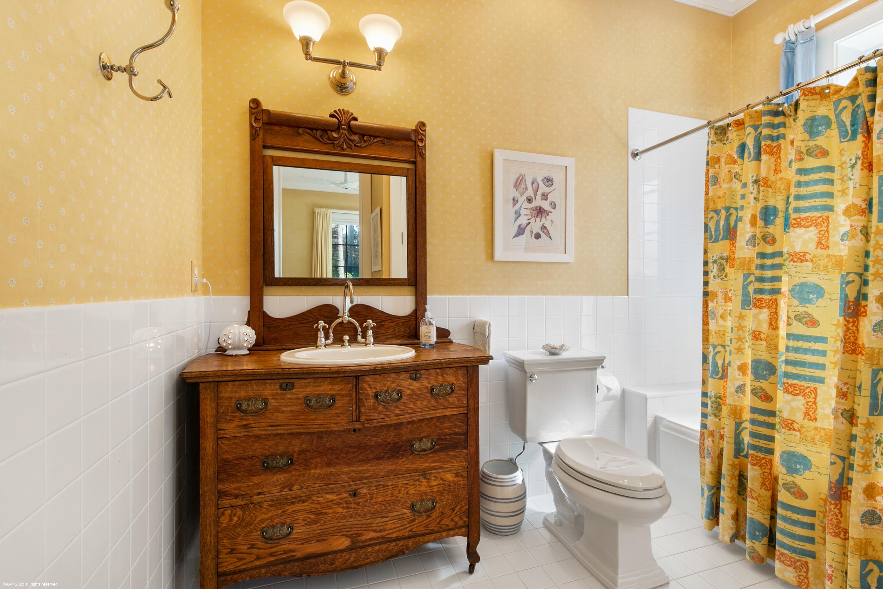 107 North Beach Road Jupiter Island, FL 33455 - Photo 36 of 55 a bathroom with a granite countertop toilet a sink and a shower