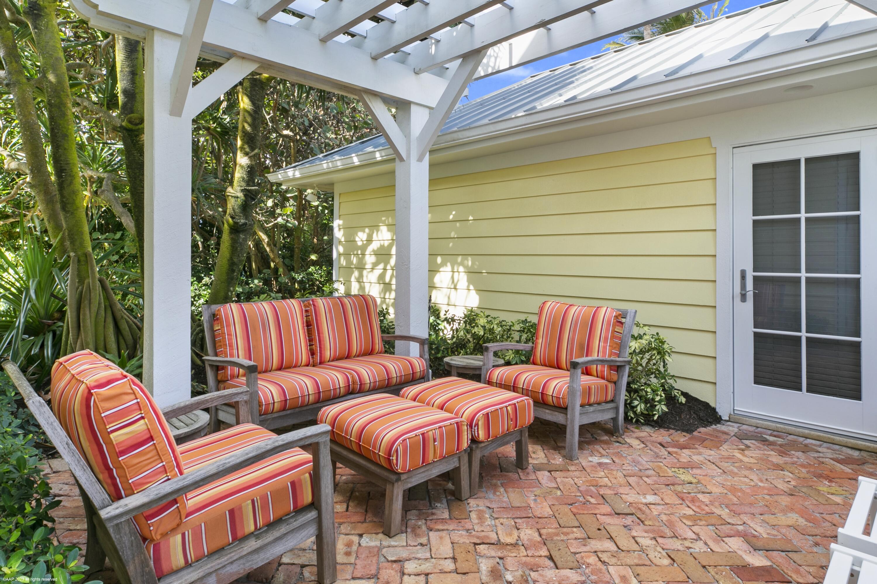 107 North Beach Road Jupiter Island, FL 33455 - Photo 37 of 55 a outdoor living space with patio furniture and potted plants