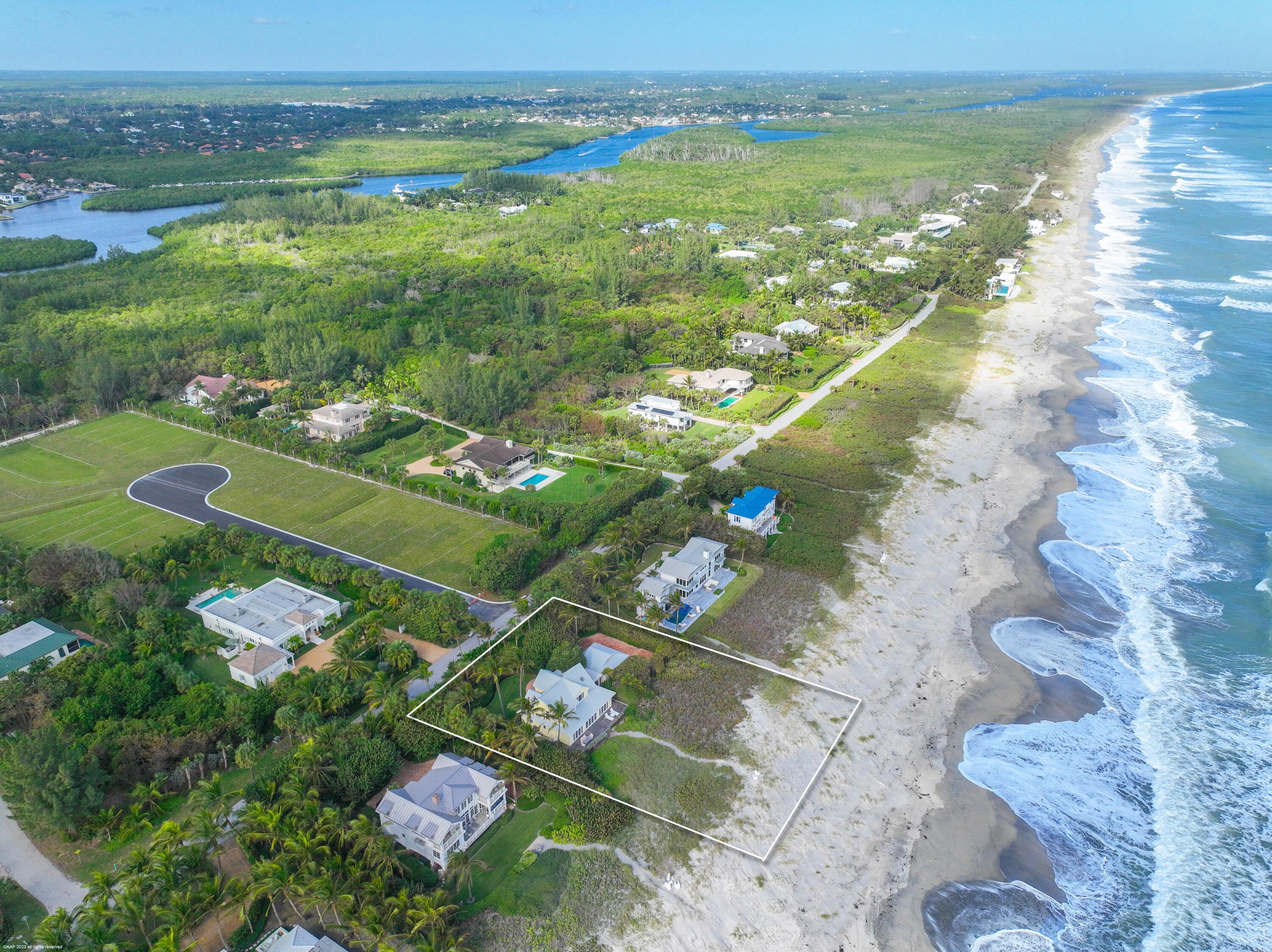 107 North Beach Road Jupiter Island, FL 33455 - Photo 9 of 55 a view of a lake with a city