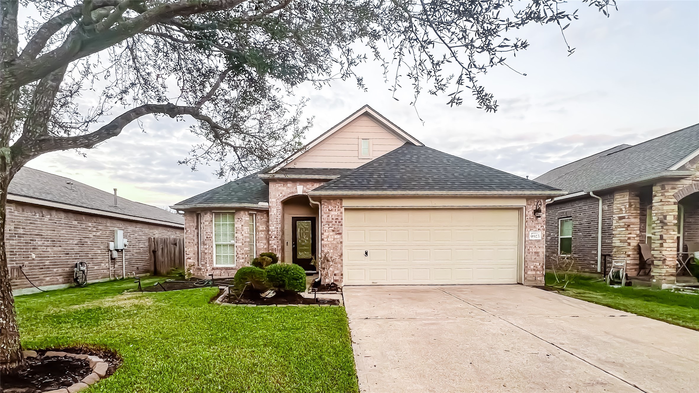 9923 Opal Rock Drive Rosharon, TX 77583 - Photo 1 of 20 a front view of a house with garden