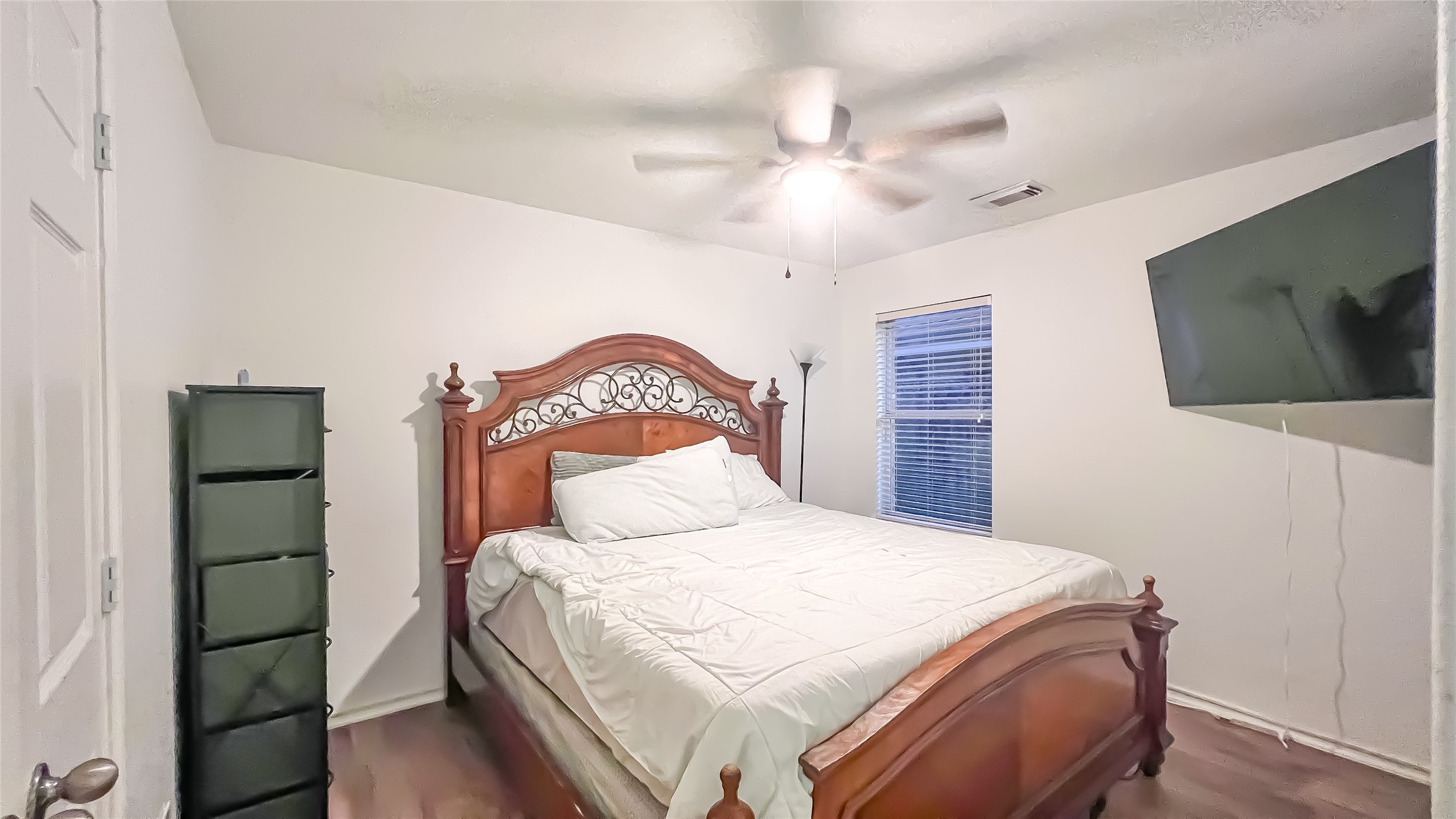 9923 Opal Rock Drive Rosharon, TX 77583 - Photo 13 of 20 a bedroom with a bed and a flat tv screen on dresser