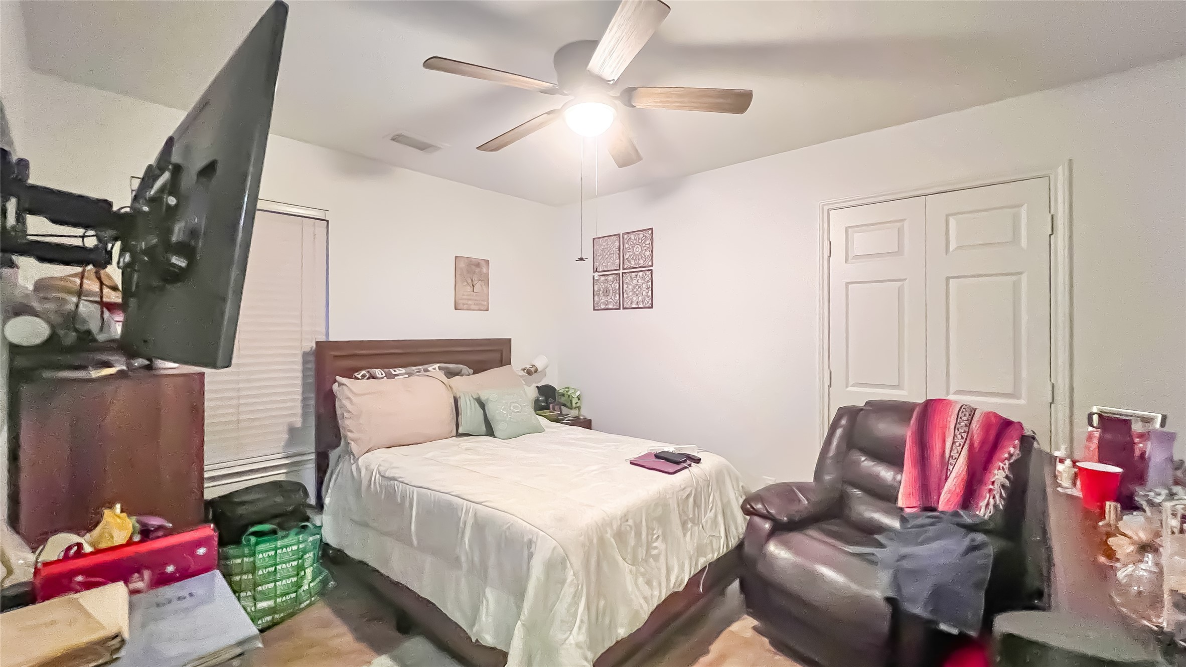9923 Opal Rock Drive Rosharon, TX 77583 - Photo 14 of 20 a bedroom with a bed and a chandelier
