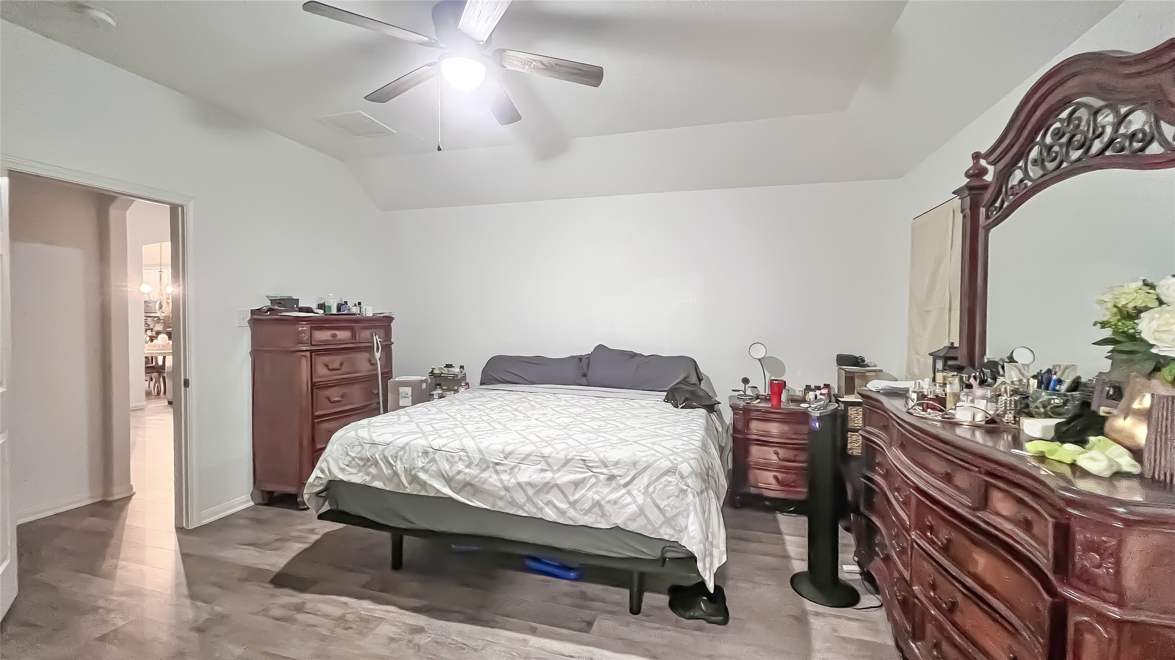 9923 Opal Rock Drive Rosharon, TX 77583 - Photo 15 of 20 a bedroom with a bed table chair and a chandelier