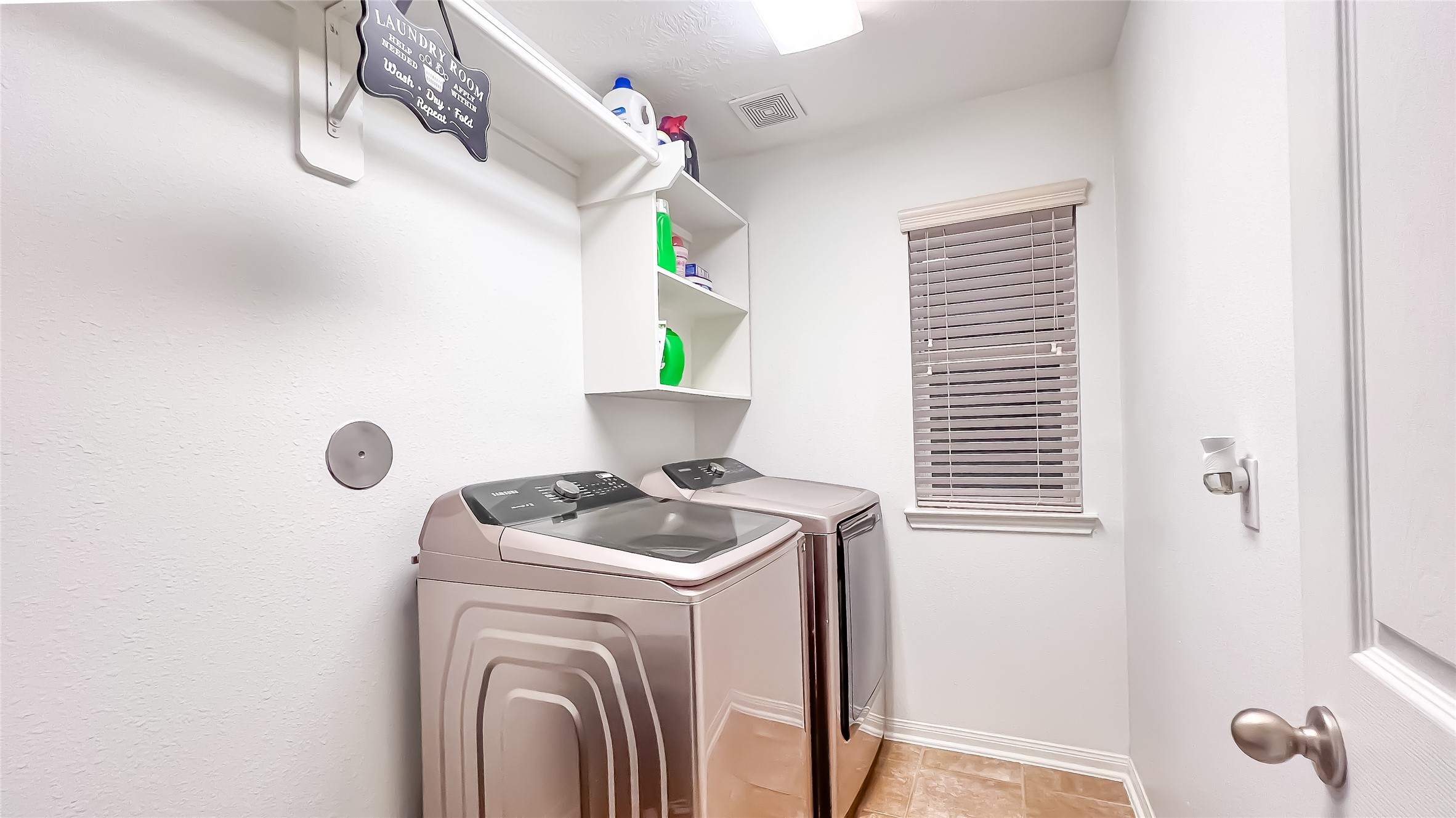 9923 Opal Rock Drive Rosharon, TX 77583 - Photo 18 of 20 a utility room with dryer and washer