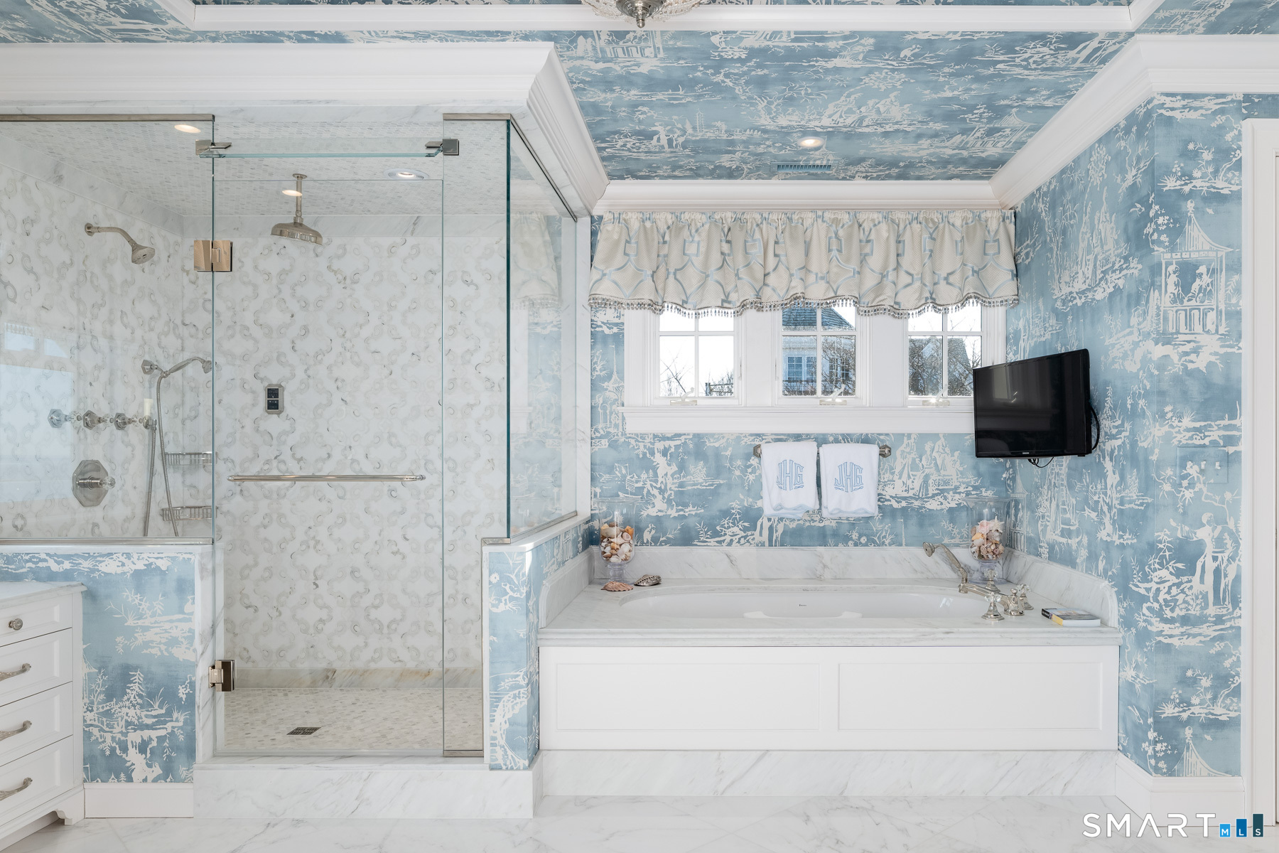 10 Shorehaven Road Norwalk, CT 06855 - Photo 19 of 33 a bathroom with a sink a mirror and a shower