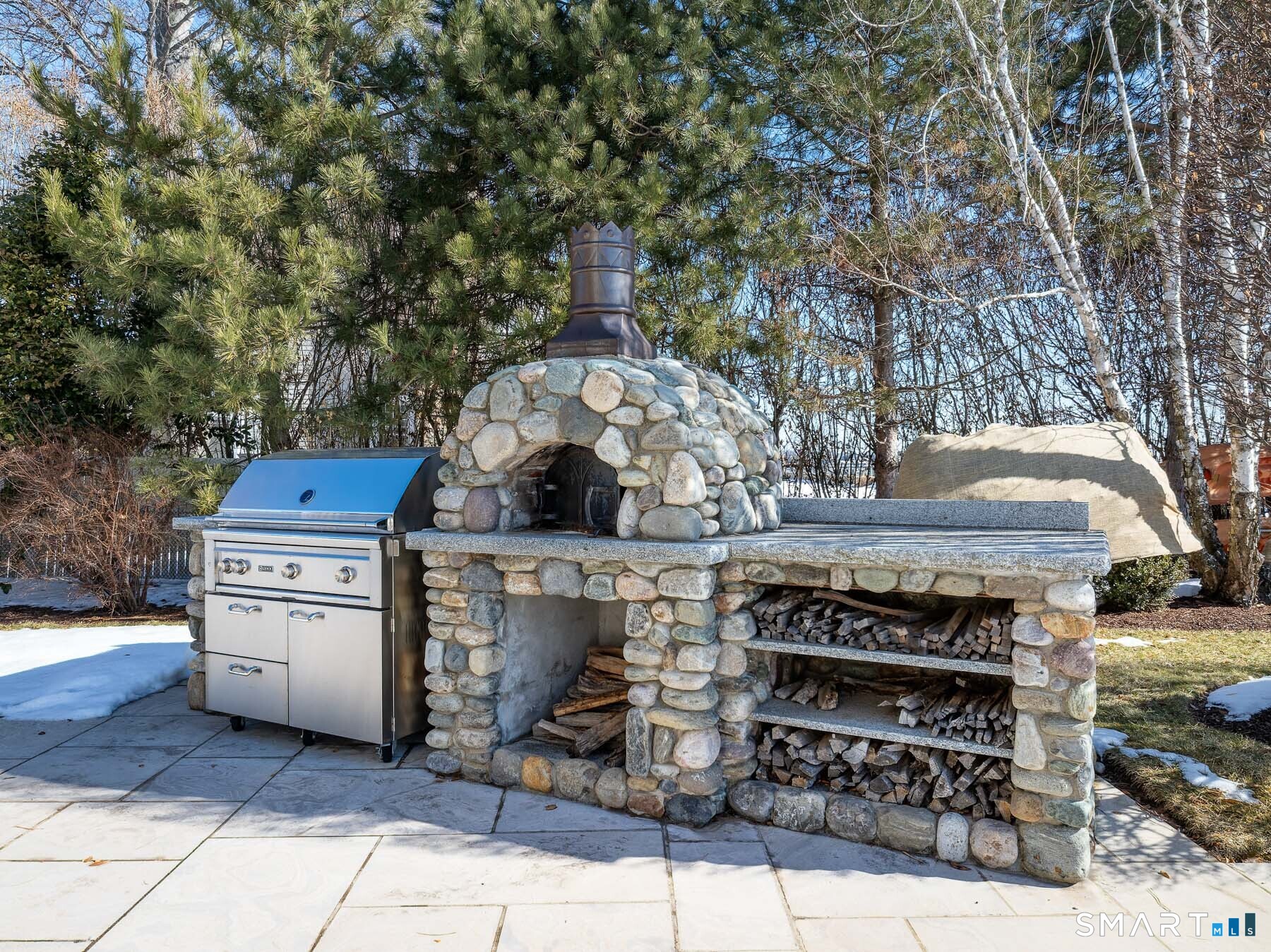10 Shorehaven Road Norwalk, CT 06855 - Photo 27 of 33 a open kitchen with a stove and a fireplace