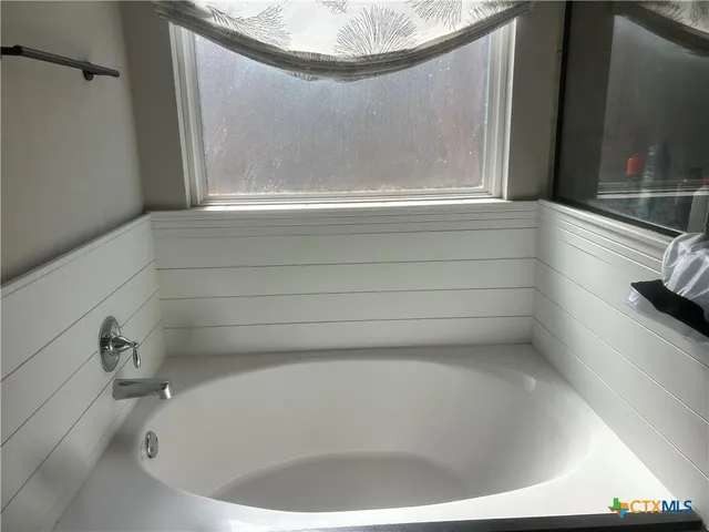 a bathroom with a bathtub