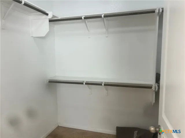 a view of a room with racks on the wall