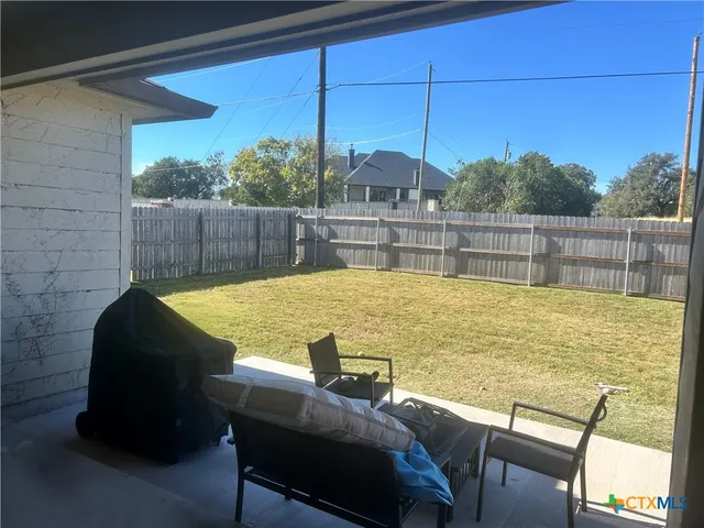 a view of a swimming pool with a lounge chair