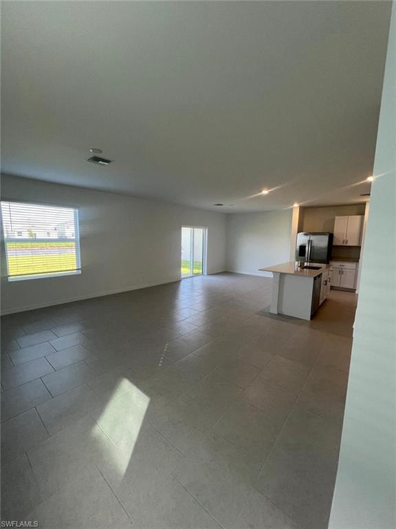 19763 Garden Rdg Court Lehigh Acres, FL 33936 - Photo 3 of 12 a view of a livingroom with furniture and a window