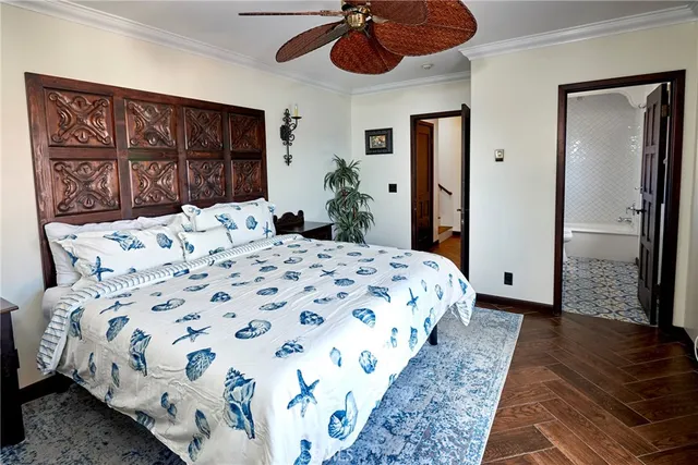 a bedroom with a bed a dresser and a large mirror