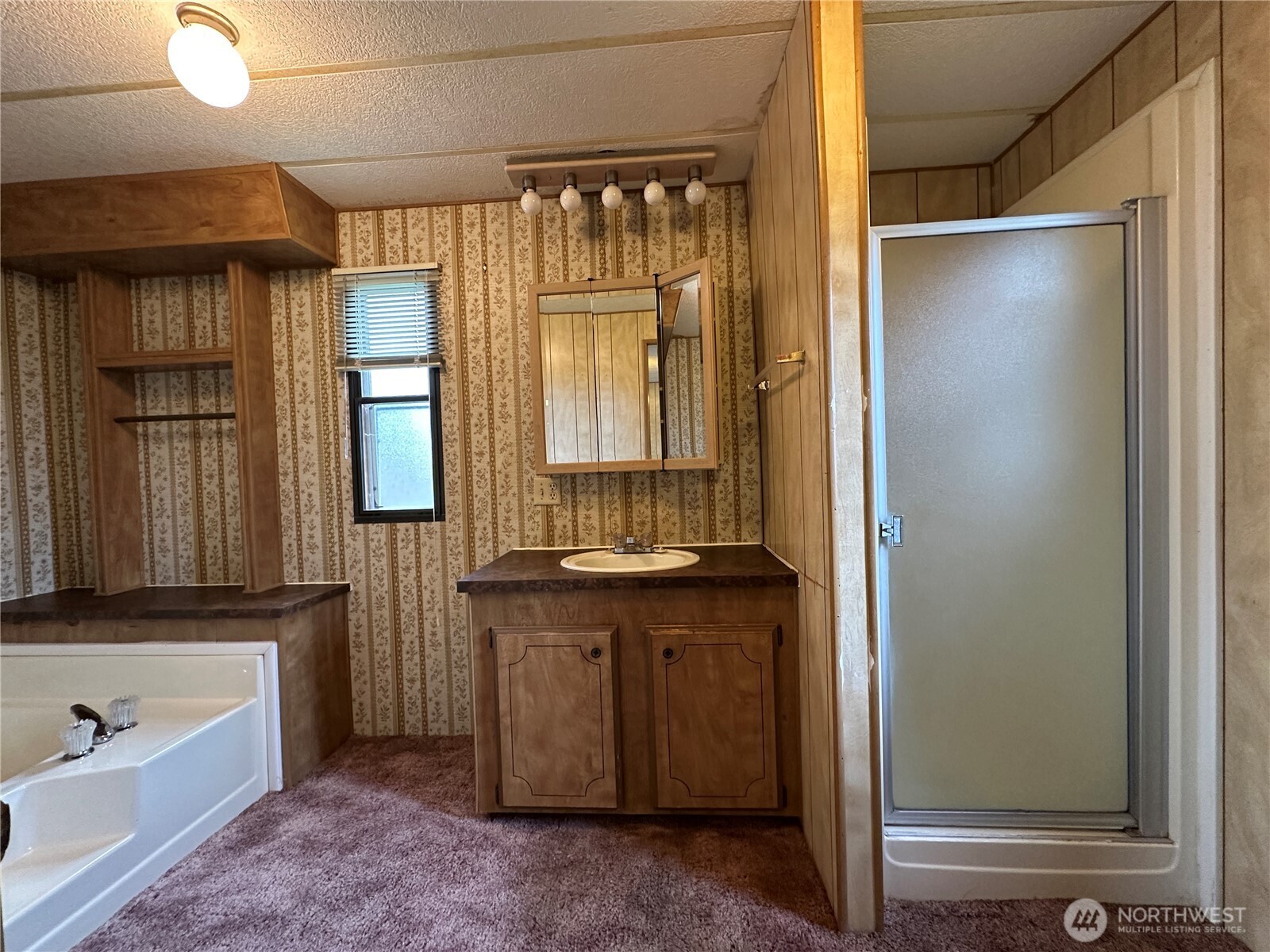57 Clemons Road, Unit 49 Montesano, WA 98563 - Photo 18 of 23 a bathroom with a granite countertop sink and a mirror