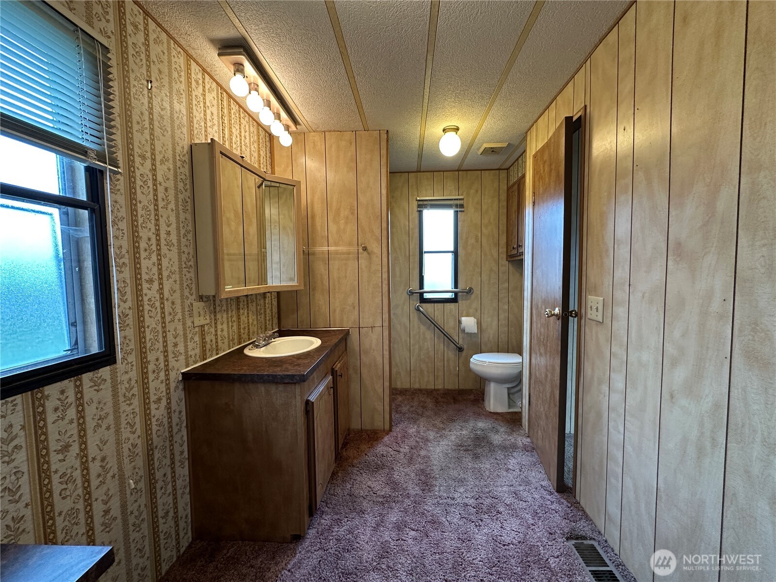 57 Clemons Road, Unit 49 Montesano, WA 98563 - Photo 19 of 23 a bathroom with a sink a toilet and shower