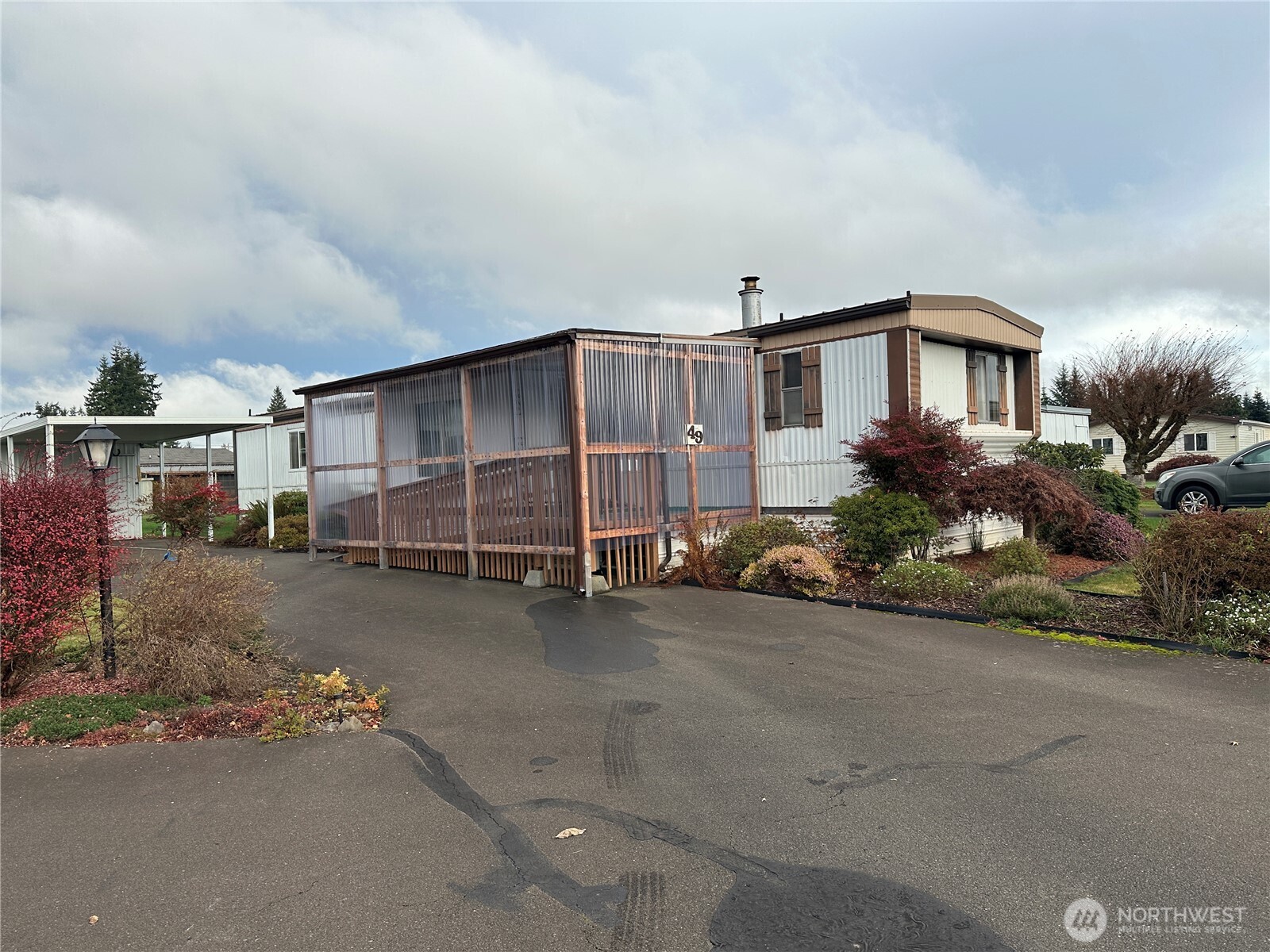 57 Clemons Road, Unit 49 Montesano, WA 98563 - Photo 2 of 23 a view of a house with a yard and garage
