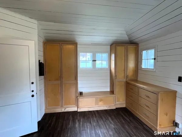a kitchen with granite countertop a refrigerator stove top oven and sink
