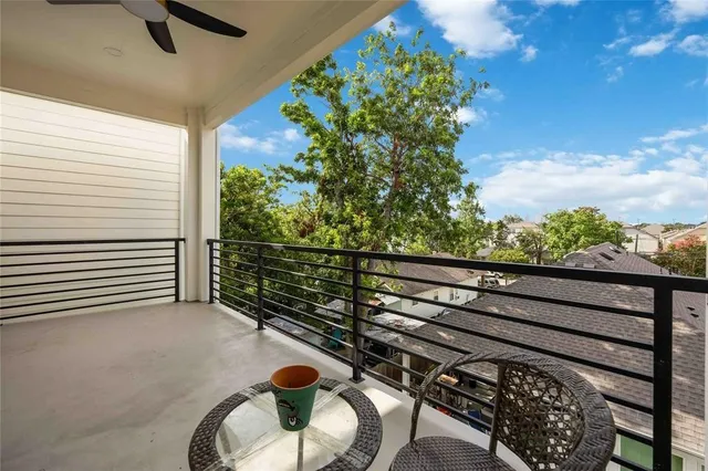 a view of a porch with furniture and a yard