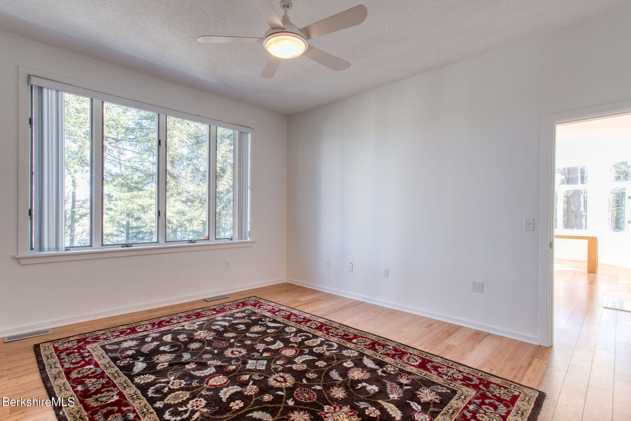 770 Summer Street, Unit 13B Lee, MA 01240 - Photo 11 of 39 wooden floor in an empty room with a window